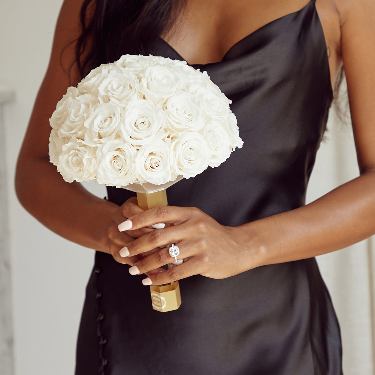 Someone holding a Venus et Fleur bridal bouquet