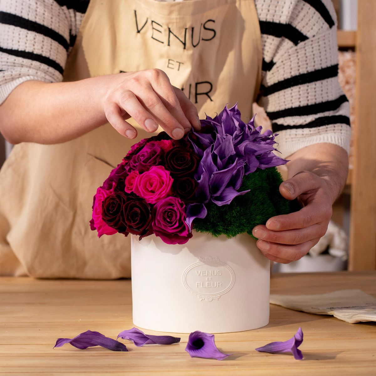 Hands arranging Purple Calla Lily Eternity Arrangement - Venus et Fleur