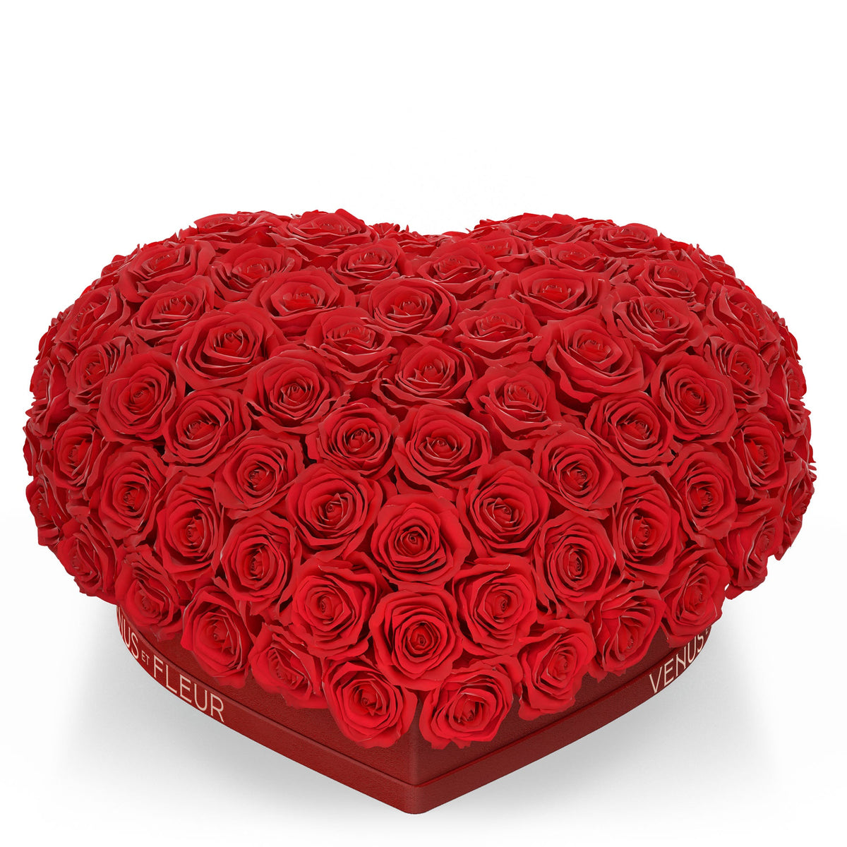 Heart-shaped arrangement of red roses in a box with the text 'VENUS ET FLEUR' on the side