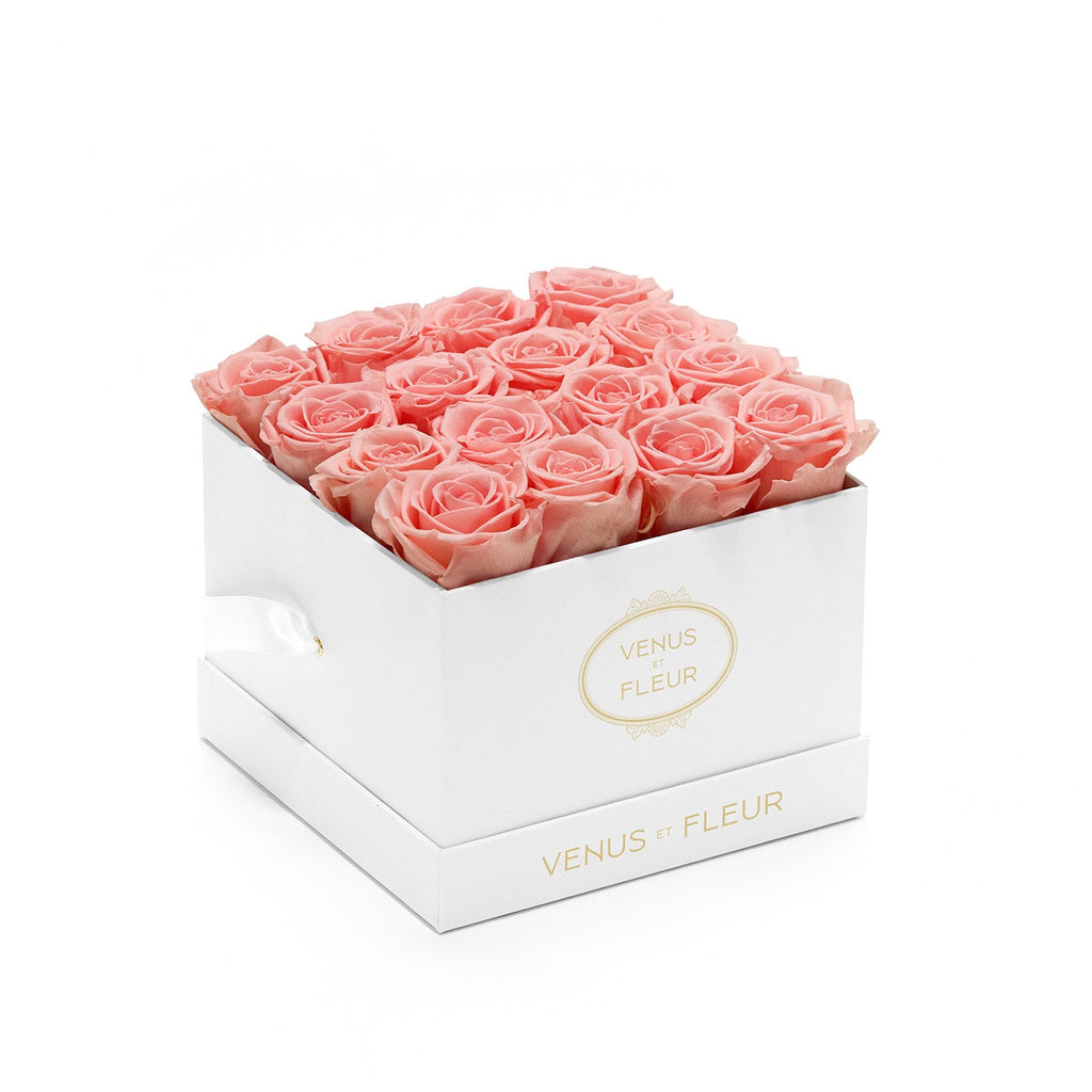 Box of pink roses in a white square box with gold text 'VENUS ET FLEUR' on the front and side.