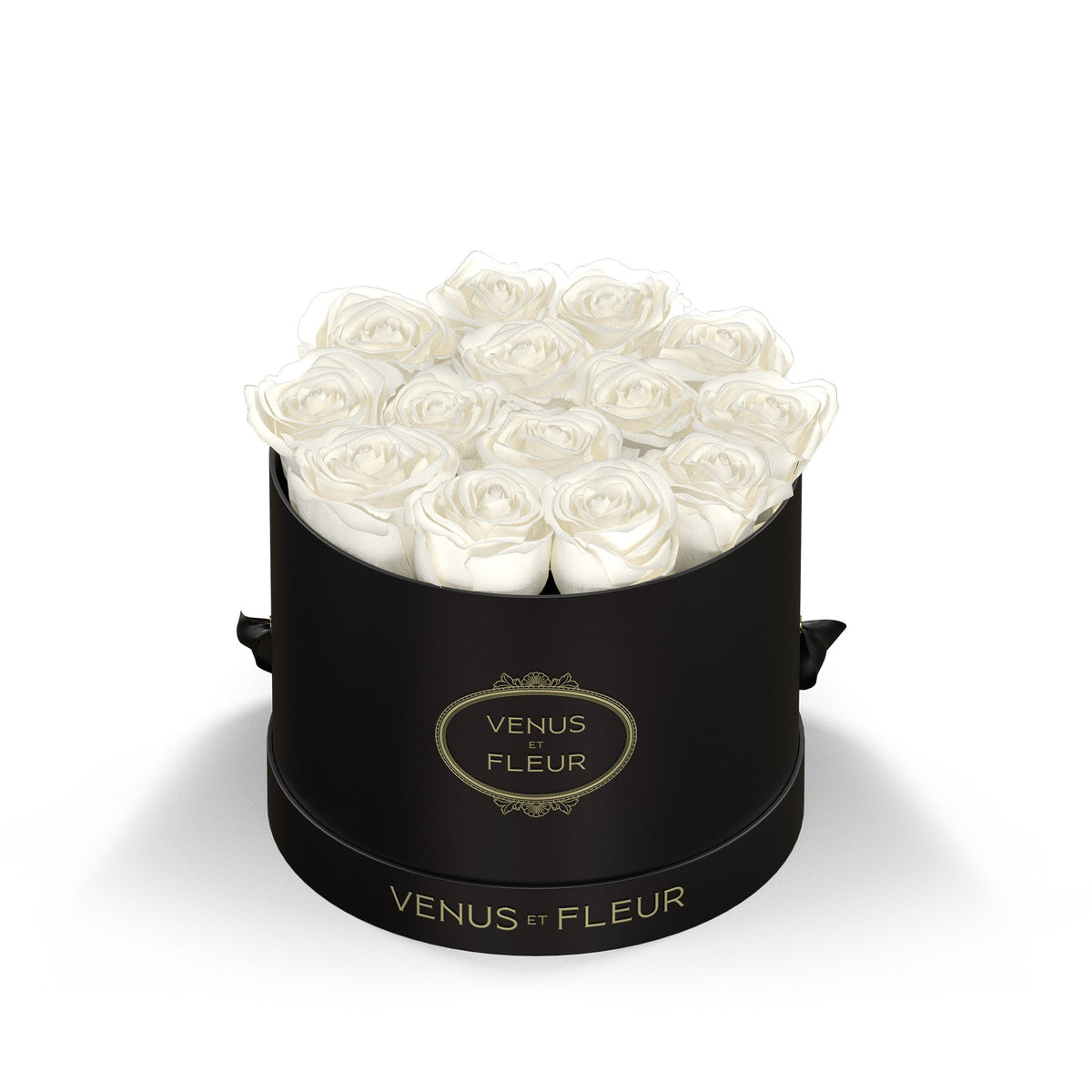 Black round box with white roses and gold text 'VENUS ET FLEUR' on the box