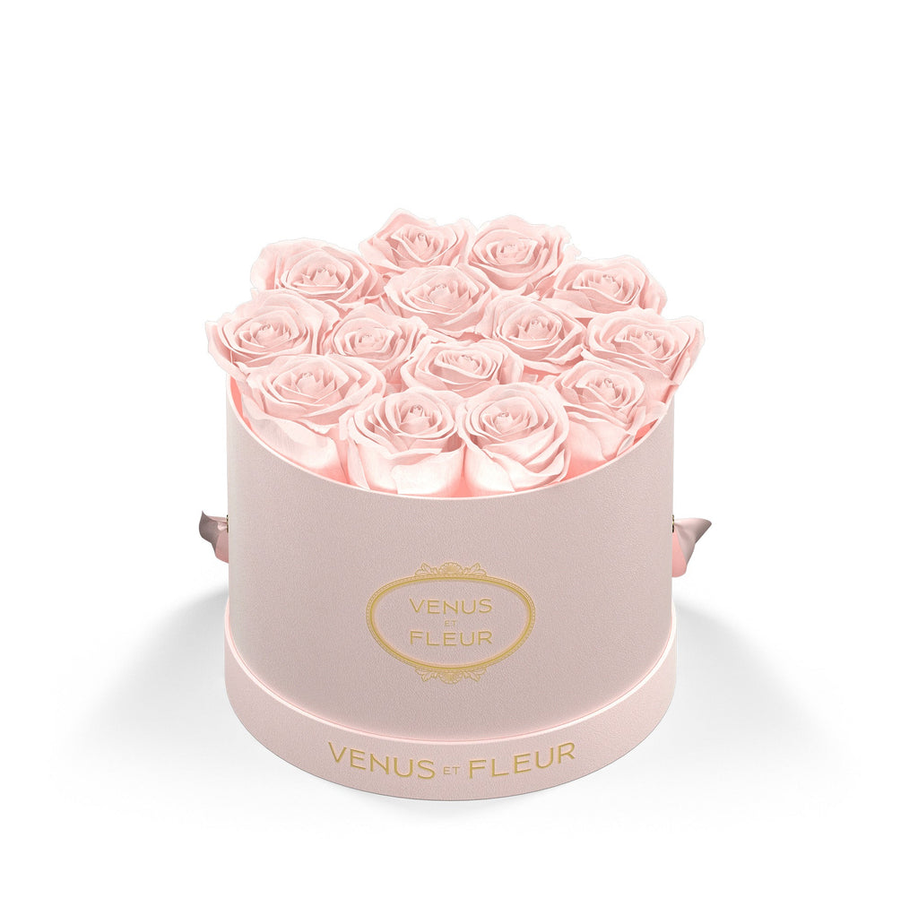 Round pink box with light pink roses and gold text 'VENUS ET FLEUR' on the box