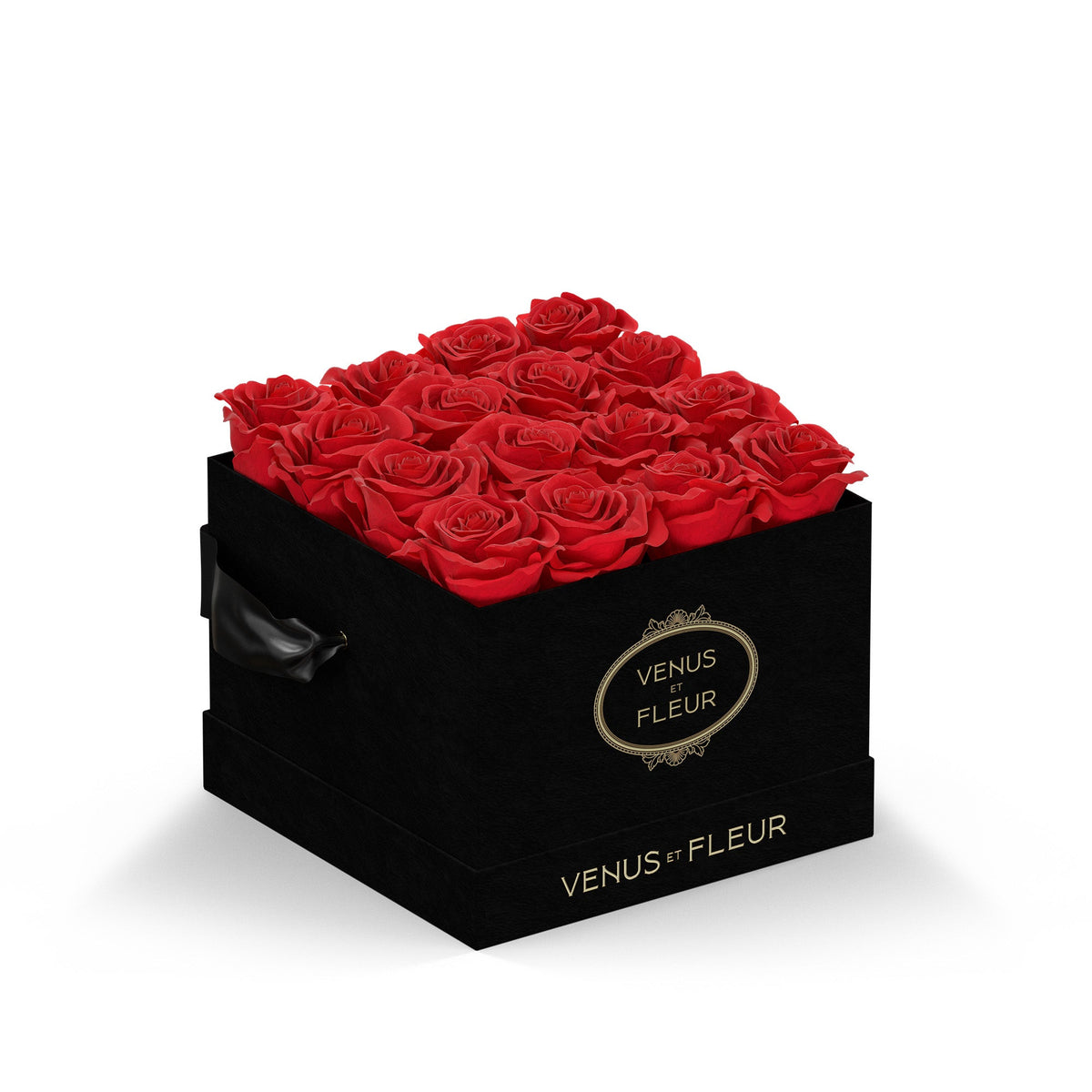 Black square box filled with red roses, with the text 'VENUS ET FLEUR' on the front and side of the box.
