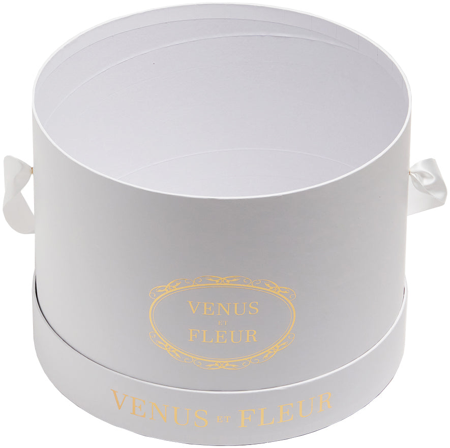 White round flower box with handles and gold text 'VENUS ET FLEUR'