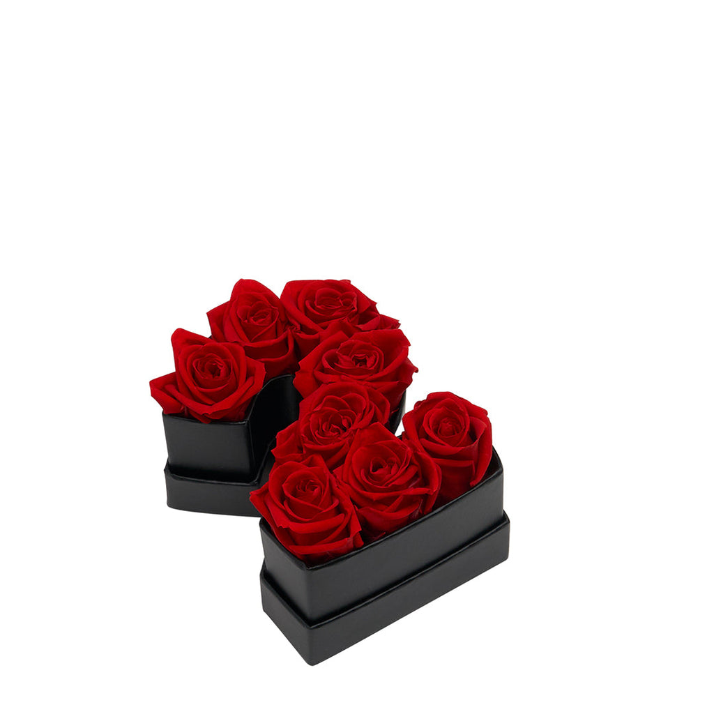Black box shaped like the number 2 filled with eight red roses